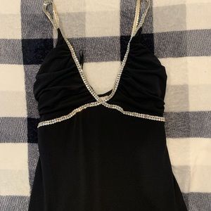 Black formal dress with simple rhinestone design.